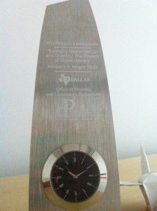 silver clock engraved with the name of my talk