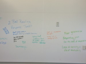 A white board with student writing, showing criteria for poor tweeting. 1 of 2.